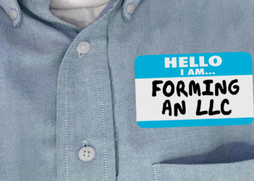 Men's shirt with a name tag that says hello I am forming an LLC