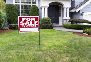 for sale by owner sign in front of blue house