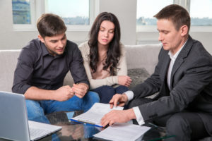 couple in san antonio meeting with a small business attorney