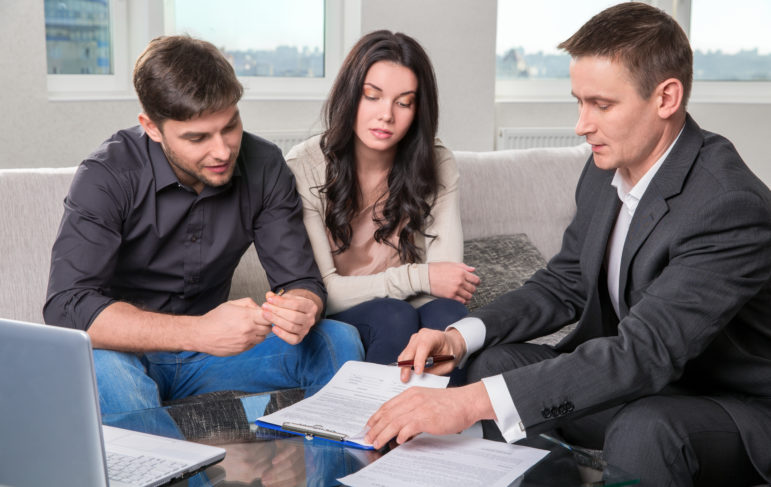 couple in san antonio meeting with a small business attorney