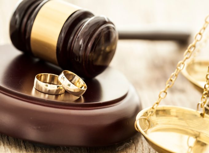 wedding rings and a gavel representing a prenuptial agreement
