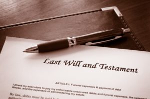 a will and a pen laying on a desk
